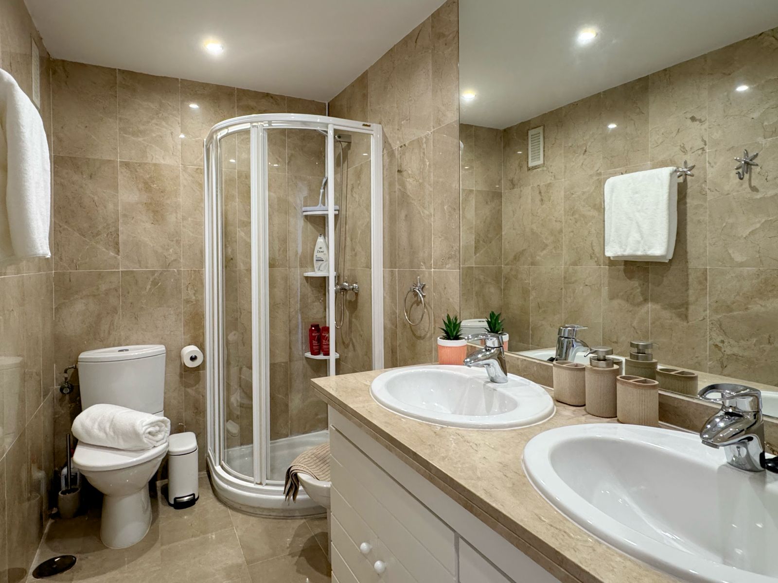 Marble shower room with double sinks