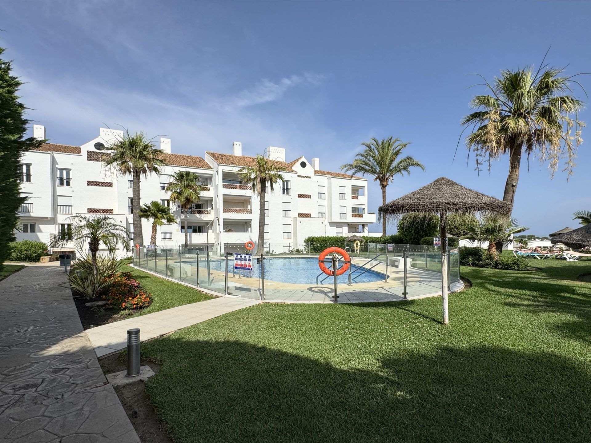 Lawns and pathways around the pool