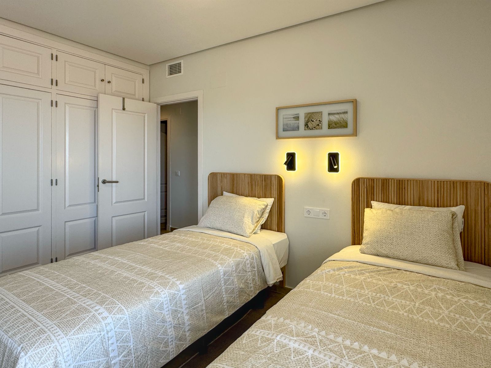 Twin bedroom with fitted wardrobes
